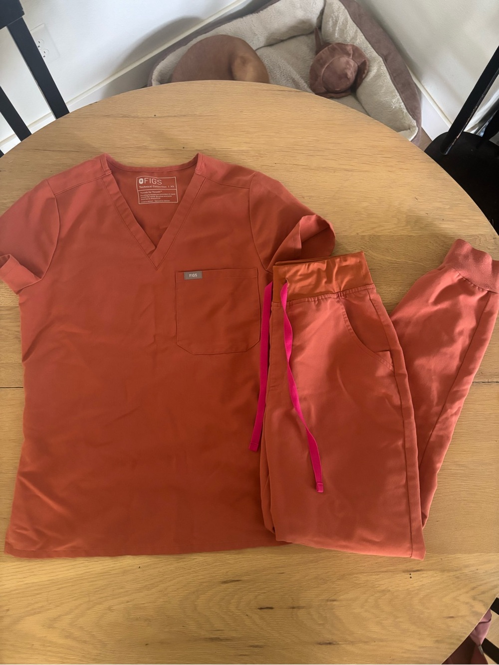 FIGS Women’s V-Neck Scrub Top & Jogger Pant Set in terracotta